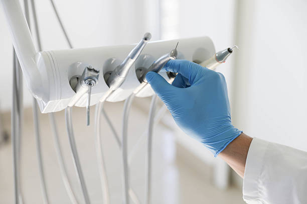 Professional Tooth Extraction technician working in North St. Paul, MN